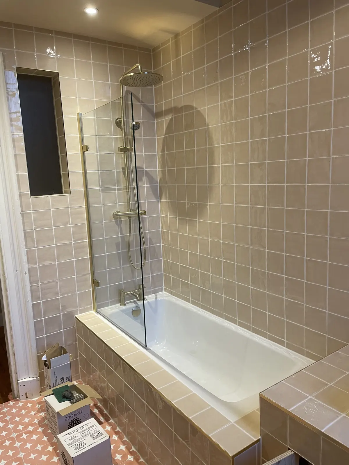 Full height wall tiling around a bath, completed by Scott-Eco Builders in Edinburgh