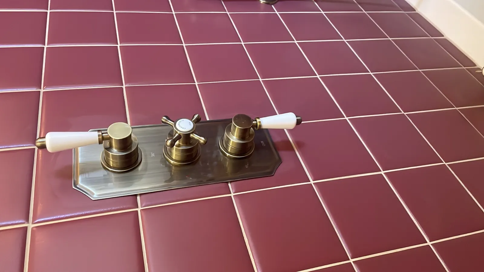 Existing bath taps and pipework recorded before strip out on an Edinburgh plumbing job