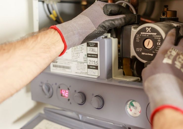 Engineer carrying out a water heater repair in Edinburgh