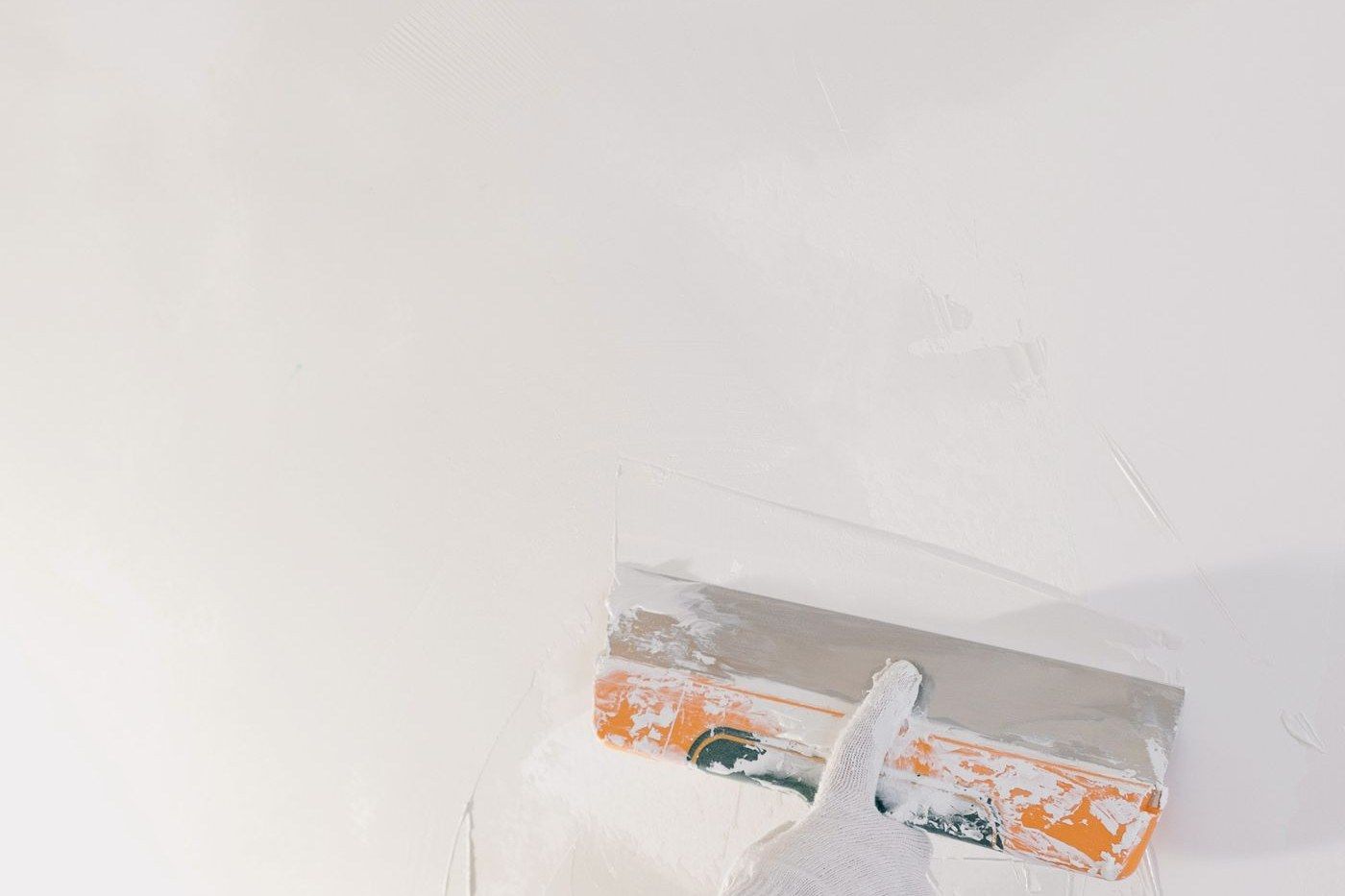 Internal plastering being skimmed with a trowel in Edinburgh