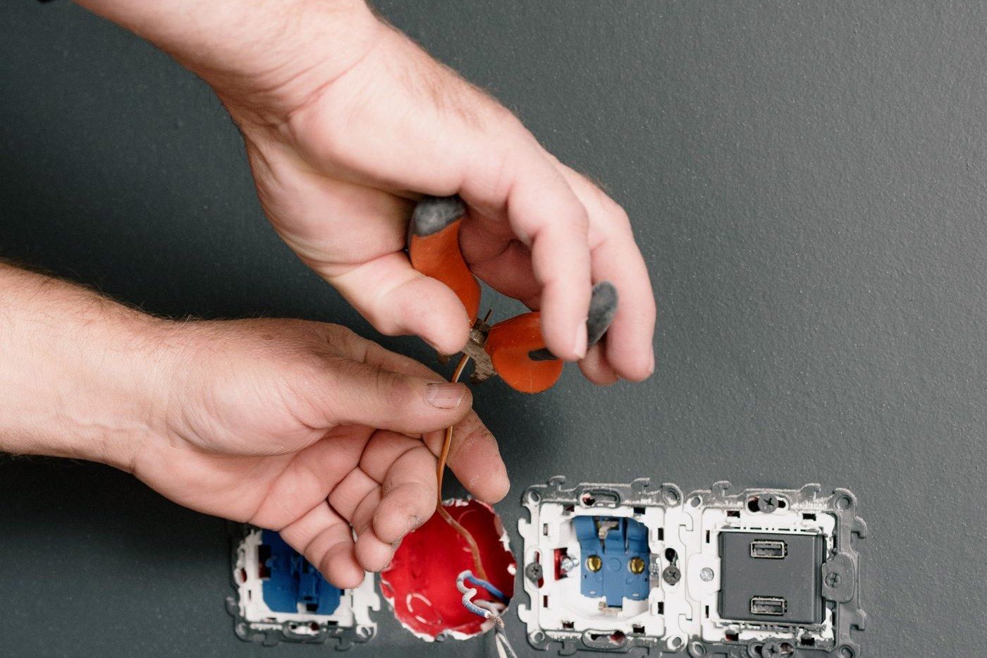 Sockets and switches being wired into a wall in an Edinburgh home