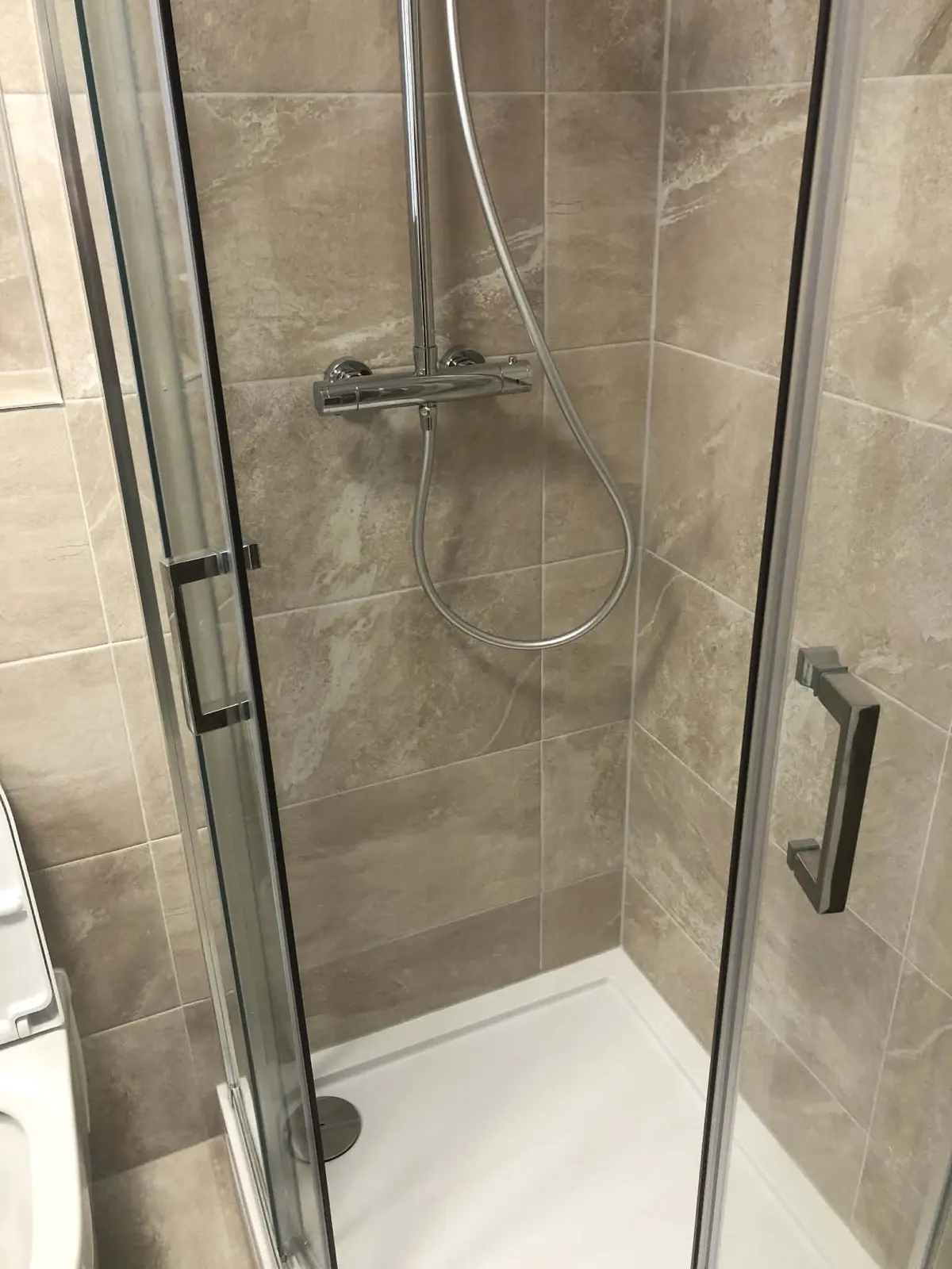 Stone effect tiled shower enclosure completed by Scott-Eco Builders in Musselburgh