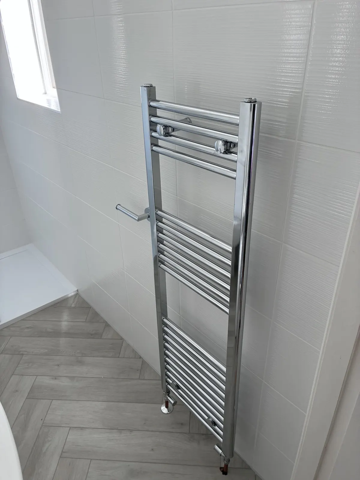 Heated towel rail fitted on a bathroom refit in East Lothian by Scott-Eco Builders